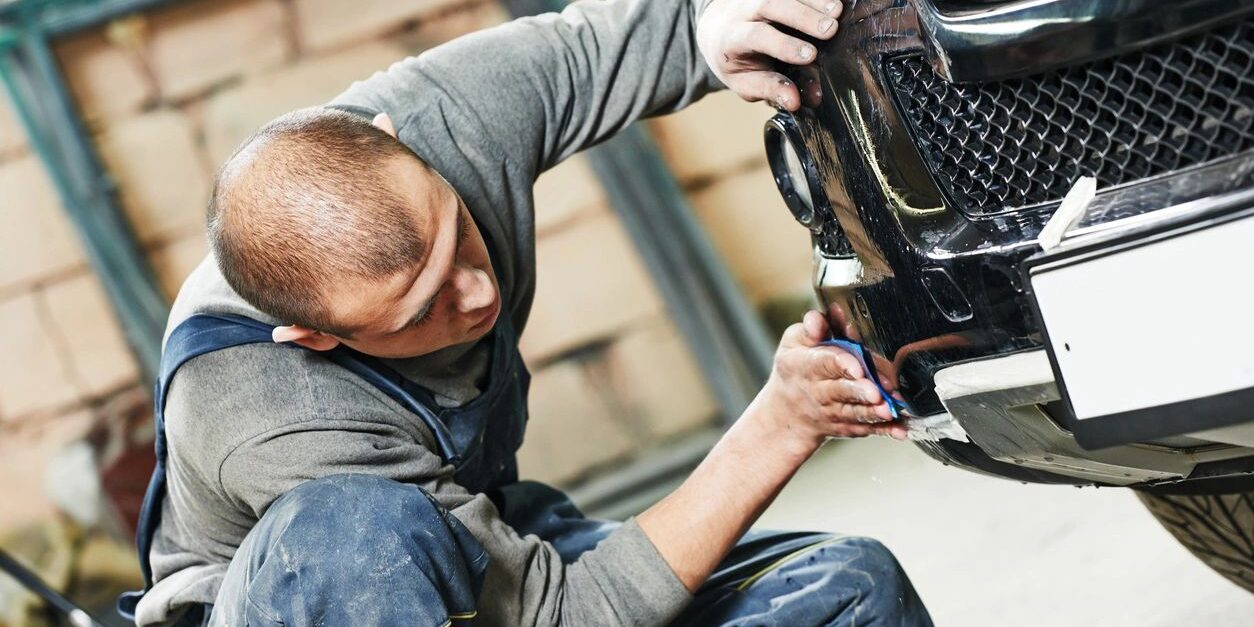 auto mechanic worker sanding polishing bumper car at automobile repair and renew service station shop by sandpaper (auto mechanic worker sanding polishing bumper car at automobile repair and renew service station shop by sandpaper, ASCII, 115 componen